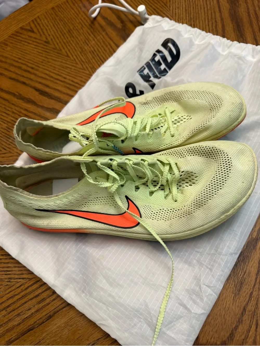 Nike Racing Shoes - Light Green with Orange Swoosh